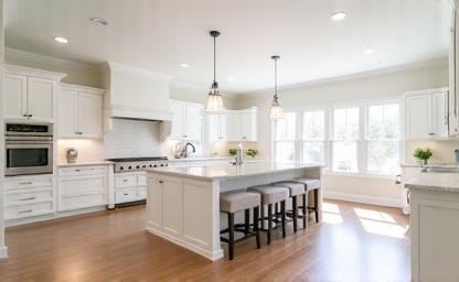 A stunning completed full kitchen renovation project showcasing new cabinets, countertops, flooring, and lighting.